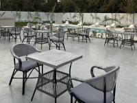 a group of tables and chairs and a pool at Nakhil Pyramids Resort in Cairo