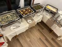 a table with three trays of food on it at Devin River in Devin