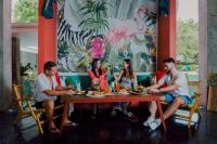 a group of people sitting around a table at Tolani Resort Koh Samui in Lamai