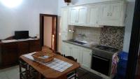 A kitchen or kitchenette at Appartamenti Frassanito