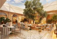 Un restaurante con mesas y sillas en un edificio. en Conrad Athens The Ilisian, en Atenas