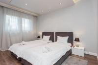 Posteľ alebo postele v izbe v ubytovaní Oxygen Residence