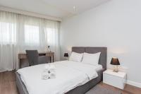 Posteľ alebo postele v izbe v ubytovaní Oxygen Residence