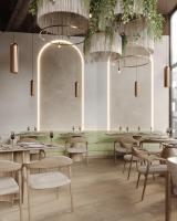 オスナブリュックにあるバーグマン ボーディングハウス オスナブリュックのテーブルと椅子とシャンデリアのあるレストラン