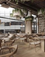 オスナブリュックにあるバーグマン ボーディングハウス オスナブリュックの部屋にテーブルと椅子があるレストラン