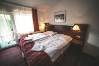 Postel nebo postele na pokoji v ubytování Hotel Racek