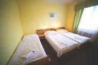 Postel nebo postele na pokoji v ubytování Hotel Racek