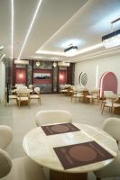 a rendering of a waiting room with tables and chairs at Hotel Rosevelt in Islamabad