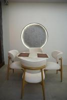 a table and four chairs in a room at Hotel Rosevelt in Islamabad