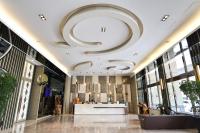 a lobby of a building with a large ceiling at Tsun Huang Hotel in Chiayi City