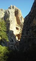 a rocky mountain with a pathway in front of it at Hostal Caminito del Rey in Alora