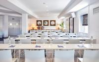 a large room with white tables and white chairs at Delamar 4*Sup-Adults only (18+) in Lloret de Mar