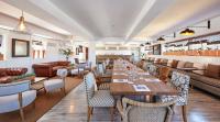 a restaurant with a long table and chairs at Delamar 4*Sup-Adults only (18+) in Lloret de Mar