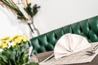 a table with a napkin on top of a table at Hotel Continental Dolomites in Selva di Val Gardena