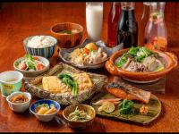 a table with various dishes of food on it at APA Hotel Kobe Sannomiya in Kobe