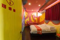 a bedroom with a bed with a painting of a unicorn at Ali Ba Ba B&amp;B in Hualien City