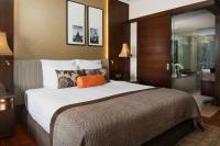 Postel nebo postele na pokoji v ubytování Anantara Riverside Bangkok Resort