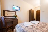 Posteľ alebo postele v izbe v ubytovaní Hotel Victoria