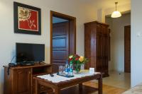 Televízia a/alebo spoločenská miestnosť v ubytovaní Hotel Victoria