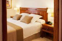 A bed or beds in a room at Princesa Yaiza Suite Hotel Resort