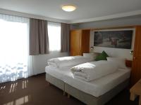 Łóżko lub łóżka w pokoju w obiekcie Bhome Gästehaus b&b / Apartments