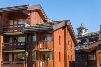 a building with a clock tower on top of it at Résidence Pierre &amp; Vacances Emeraude in Belle Plagne