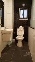 a bathroom with a toilet and a sink at Qinbianlu B&amp;B in Jiufen