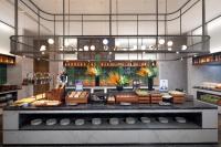 a bakery with a counter with food on display at Hampton by Hilton Cixi Guanhaiwei in Ningbo