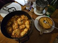 een tafel met een pan eten en een kom eten bij First Row to The Sea - Ideal for Families - Sea at Your Doorstep - House Sisko in Trogir