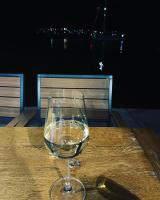 een glas wijn op een houten tafel bij First Row to The Sea - Ideal for Families - Sea at Your Doorstep - House Sisko in Trogir