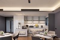 a restaurant with tables and chairs and a kitchen at Huanman Hotel Jishou State Government Branch in Ganziping