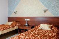 Łóżko lub łóżka w pokoju w obiekcie Hotel Irys