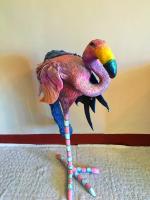a colorful toy ostrich is sitting on the floor at Camellia B&amp;B in Taitung City