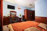 Łóżko lub łóżka w pokoju w obiekcie Hotel Irys