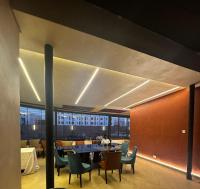 a dining room with a table and chairs at DOMO By Design Union in Lagos