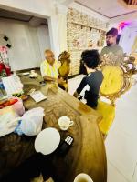 a group of people sitting around a table at White Palace airport hotel in Katunayake