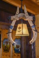 an antler chandelier with a purse hanging from it at Hotel Gasthof Süßer Grund in Albstadt