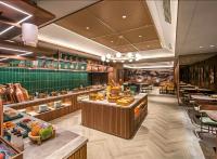 a restaurant with a buffet line with food on display at Orange Nanjing Baijia Lake Xiaolongwan Subway Station Hotel in Jiangning