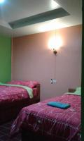 Postel nebo postele na pokoji v ubytování สิชล บ้านอุ๊ รีสอร์ท