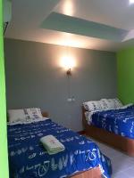 Postel nebo postele na pokoji v ubytování สิชล บ้านอุ๊ รีสอร์ท