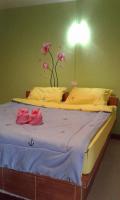 Postel nebo postele na pokoji v ubytování สิชล บ้านอุ๊ รีสอร์ท
