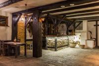 een kamer met een tafel en een bar in een gebouw bij Hotel U dobrého pastiera in Ružomberok