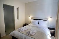 A bed or beds in a room at Rg Status Hotel