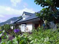 a house with a lot of plants in front of it at Fennel Resort in Checheng