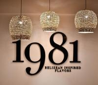 ein Ladenschild mit zwei Kronleuchtern in der Unterkunft Naïa Resort and Spa in Placencia Village