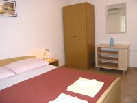 Postel nebo postele na pokoji v ubytování Apartmani Dolencic