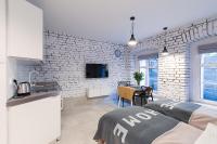 Televízia a/alebo spoločenská miestnosť v ubytovaní Homewell Apartments Wilson Park