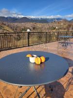 a table with fruit on it on a balcony at Zodia Craiului in Peştera