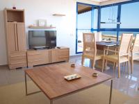 Televízia a/alebo spoločenská miestnosť v ubytovaní ApartUP Patacona Panoramic