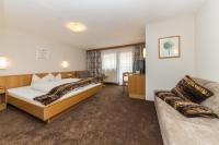 A bed or beds in a room at Hotel Idhof
